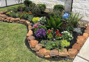 A colorful garden bed blending long-lasting perennials with seasonal annuals—crafted near Lake Houston in the Humble area.