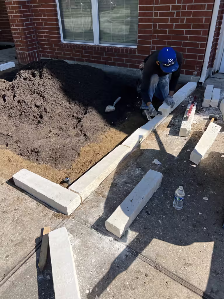 Good screened lawn and garden topdressing mix beeing added to a front yard flower bed 